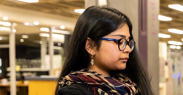 A female student studying in the UCD James Joyce library.